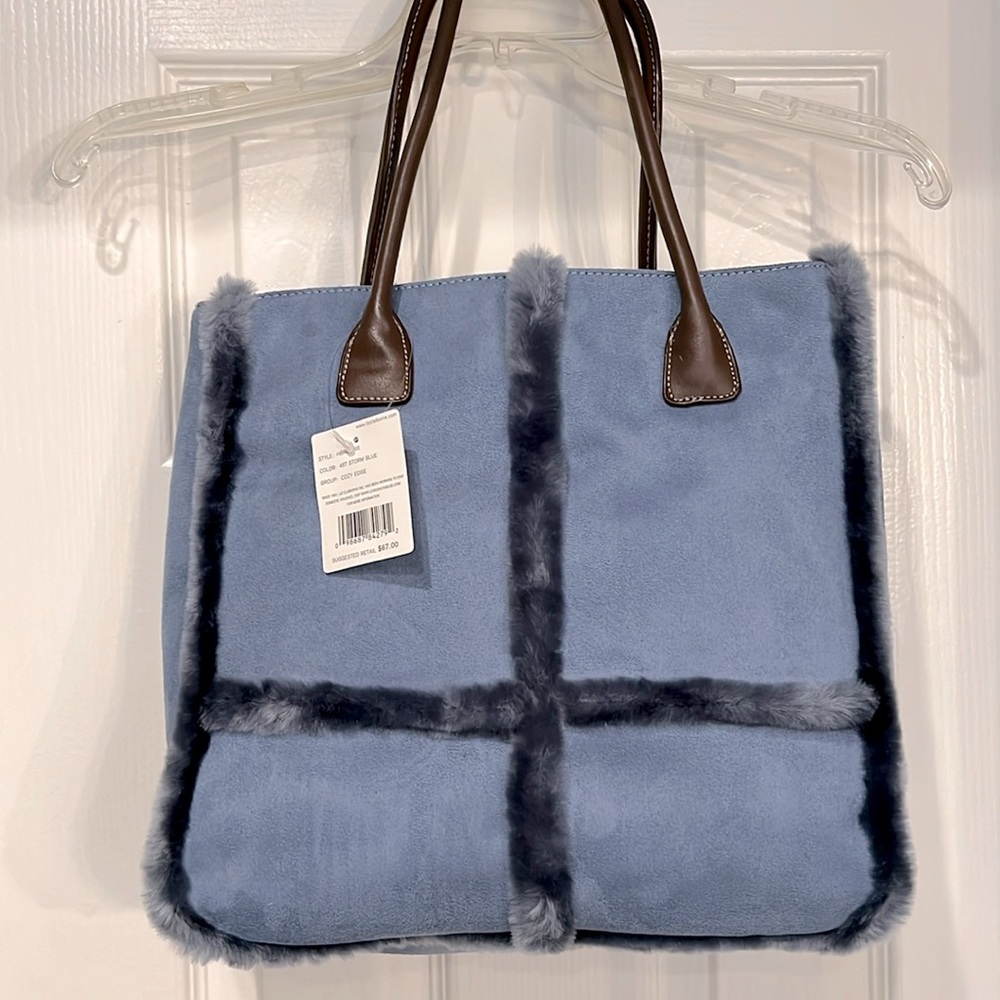 Liz Claiborne faux blue large handbag. Has faux blue trim and brown straps.